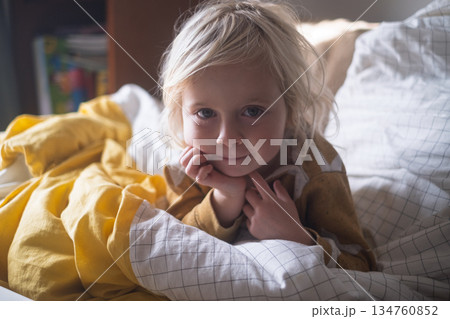 4 Year Old Blonde Girl Resting at Home Under a Blanket in Cold Weather 4 Year Old Blonde Girl Resting at Home Under a Blanket in Cold Weather 134760852
