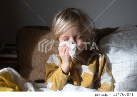 Little 4 Year Old Girl Sick at Home Wiping Her Nose with Tissue Little 4 Year Old Girl Sick at Home Wiping Her Nose with Tissue 134760871