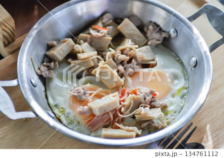 Pan fried eggs with toppings , Skillet Egg or fried egg with sausage and minced pork topping Pan fried eggs with toppings , Skillet Egg or fried egg with sausage and minced pork topping 134761112