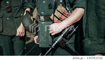 Re-enactor Dressed As German Wehrmacht Infantry Soldier In World War Ii With Submachine Gun Mp 40. German Soldier Uniform. German Soldier's Outfit 134761538
