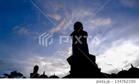 Dramatic Silhouette of Mosque Minaret Against Blue Hour Sky 134762280
