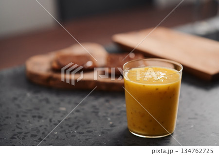 Fresh mango lulo smoothie on kitchen countertop Fresh mango lulo smoothie on kitchen countertop 134762725