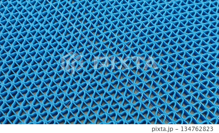 A high-angle shot shows a vibrant blue vinyl loop matting, perfect for heavy-duty use. Ideal for entrances and wet areas, this mat combines functionality with style. A high-angle shot shows a vibrant blue vinyl loop matting, perfect for heavy-duty use. Ideal for entrances and wet areas, this mat combines functionality with style. 134762823