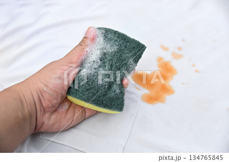 hand hold bubble with cleaning soap for clean dirty stain on shirt fabric hand hold bubble with cleaning soap for clean dirty stain on shirt fabric 134765845