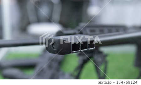 Highres firearm component imagery, Detailed view of weapon muzzle and barrel, Sharp highresolution image highlighting firearm construction details and intricate surface textures 134768124