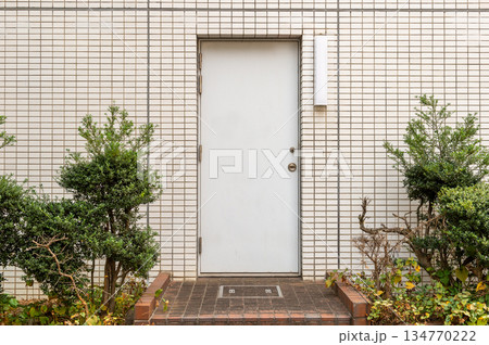 sidewalk by street wall  and  door 134770222