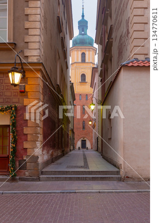 Narrow Alley and Tower in Old Town Warsaw Poland 134770611