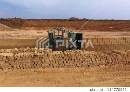 Shell quarry quarry. Cutting seashell into blocks right away in a quarry. 134770955