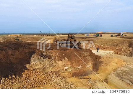 Shell quarry quarry. Cutting seashell into blocks right away in a quarry. 134770956