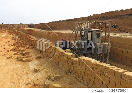 Shell quarry quarry. Cutting seashell into blocks right away in a quarry. Shell quarry quarry. Cutting seashell into blocks right away in a quarry. 134770964