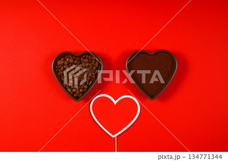 Heart coffee. Roasted coffee beans in the shape of heart on bright red background. Concept of coffee love, Valentines Day, 134771344
