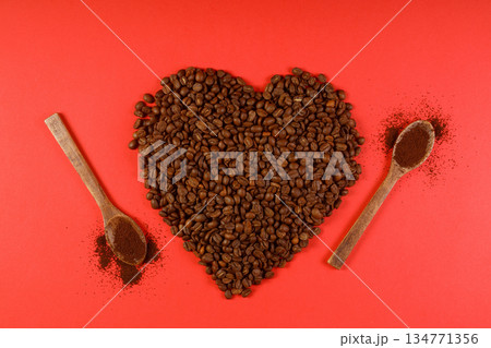 Heart coffee. Roasted coffee beans in the shape of heart on bright red background. Concept of coffee love, Valentines Day, 134771356