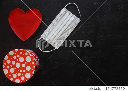 Red plush heart with face mask on stone background. Top view, copy space. Valentines day concept. 134772230