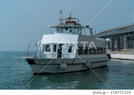 Passenger ferry boat moored at pier in port terminal Venice, Italy Passenger ferry boat moored at pier in port terminal Venice, Italy 134772329