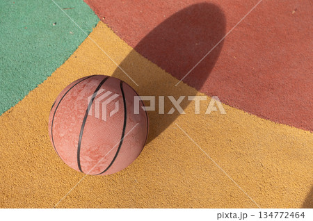 Basketball On Colorful Outdoor Court With Shadow And Painted Surface Basketball On Colorful Outdoor Court With Shadow And Painted Surface 134772464