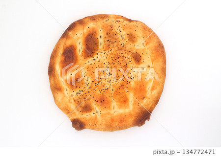 Slices of Ramadan Pita (Ramazan Pidesi) Traditional Turkish bread for holy month Ramadan on white background 134772471