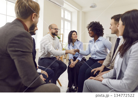 Business people sitting in office making deal or signing contract on meeting. Business people sitting in office making deal or signing contract on meeting. 134772522