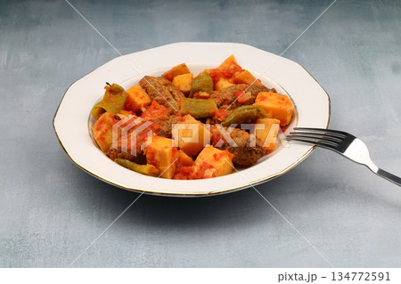 Traditional Homemade Turkish Food Kofte - Kofta with Tomato Sauce and Potatoes. (Turkish name; Izmir kofte) Traditional Homemade Turkish Food Kofte - Kofta with Tomato Sauce and Potatoes. (Turkish name; Izmir kofte) 134772591