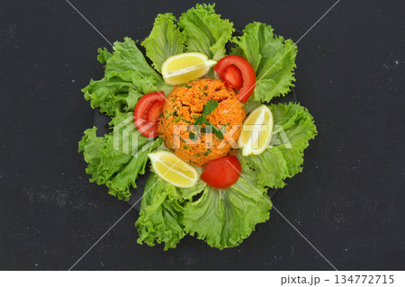 Traditional Turkish bulgur salad Kisir close-up on a plate on the table. Horizontal view from above 134772715