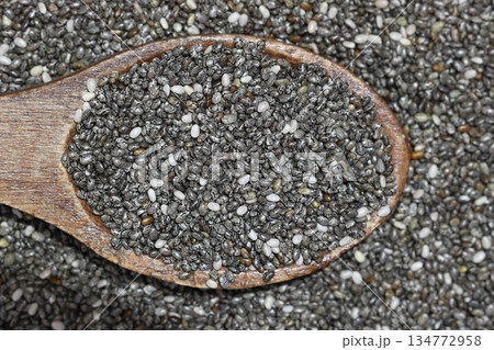 Chia seeds in wooden spoon. Healthy superfood rich in Omega 3 fatty acids. 134772958