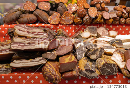 Cured dried meat on market stall 134773018