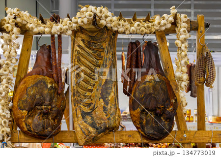 Cured meat in smokehouse 134773019