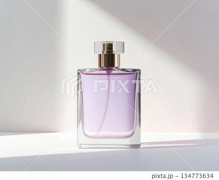Cosmetic markets. Purple perfume bottle on background in pastel color with sunlight. Cosmetic markets. Purple perfume bottle on background in pastel color with sunlight. 134773634