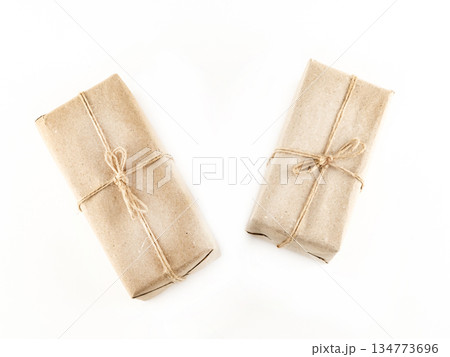 Two brown boxes with a string tied to them 134773696