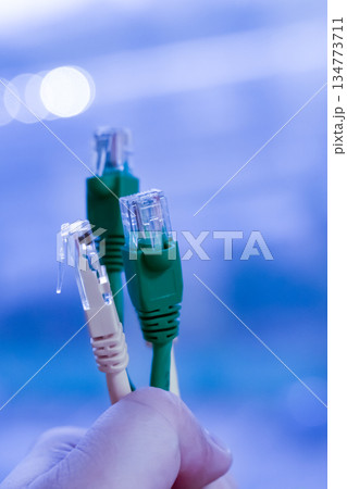 several rj 45 - wires for the Internet, on a blue background of a computer center 134773711
