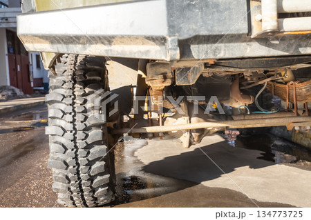 old car suspension from below. car transmission and wheels 134773725