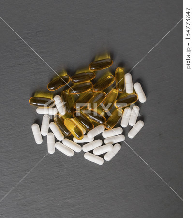omega 3 6 9 in capsule form and magnesium dietary supplement lie on a neutral background 134773847