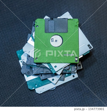 many floppy disks for storing information. symbol of storing and saving information on a computer 134773901