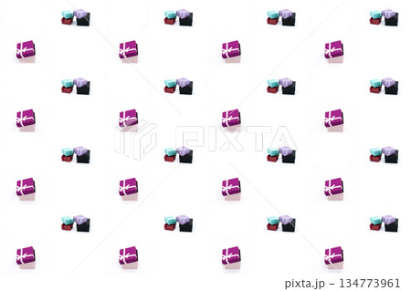 assorted gift in a multi-colored wrapper, striped, red and lilac on an isolated background assorted gift in a multi-colored wrapper, striped, red and lilac on an isolated background 134773961