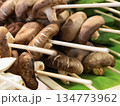 assorted mushroom skewers and vegetables on wooden skewers selective focus 134773962