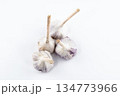 young garlic lies on a light background. fresh vegetables 134773966