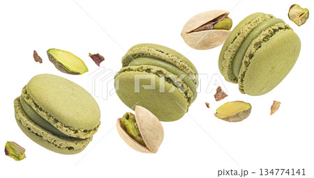 Pistachio macarons flying with nuts isolated on white background, full depth of field 134774141