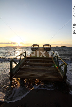 Old abandoned wooden fishing pier on the sea in the countryside 134774526