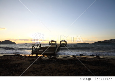 Old abandoned wooden fishing pier on the sea in the countryside 134774527