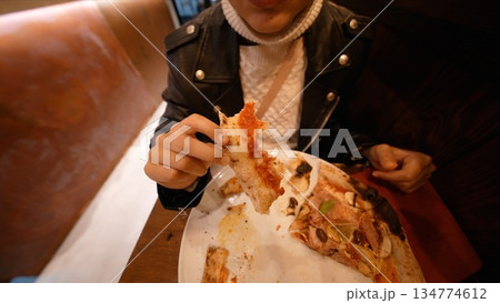 Informal moment savoring seafood with careless enjoyment 134774612