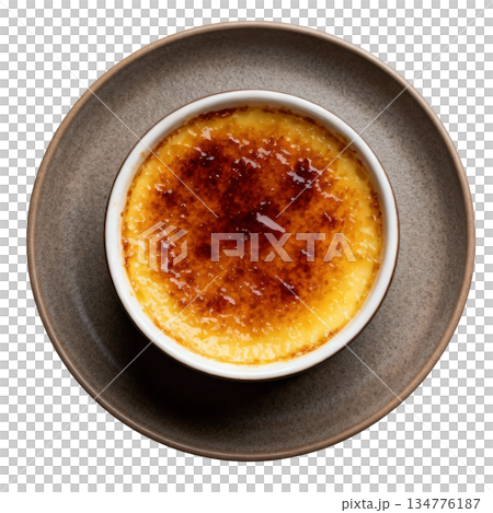 Delicious creme brulee dessert with caramelized top. Sweet gourmet custard food served on matte dish, overhead 134776187