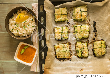 Oven baked courgettes Oven baked courgettes 134777256