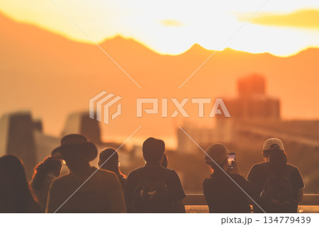 Oct 1 2025 Silhouetted Crowd Watching Sunset Over Mountain Range And City Skyline Oct 1 2025 Silhouetted Crowd Watching Sunset Over Mountain Range And City Skyline 134779439
