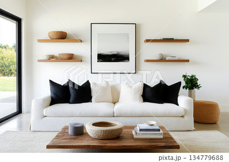 Modern living room with minimalistic decor and natural light. 134779688