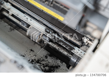 Broken laser printer cartridge on white background. Broken laser printer cartridge on white background. 134780706