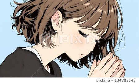 手を合わせてお祈りをしている若い女性