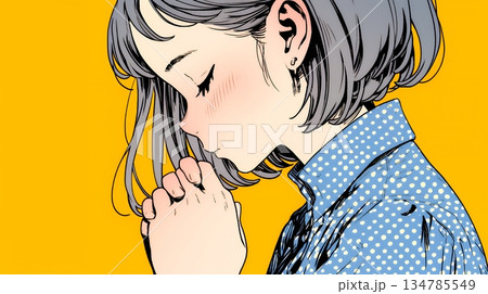 手を合わせてお祈りをしている若い女性