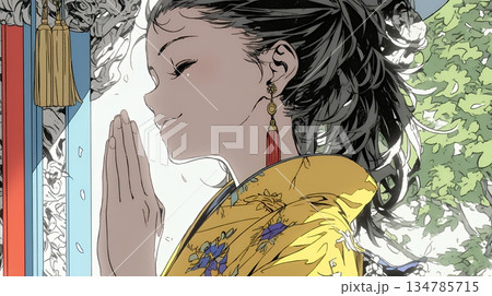 手を合わせてお祈りをしている和服姿の若い女性