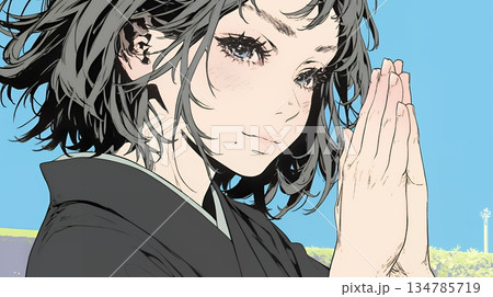 手を合わせてお祈りをしている和服姿の若い女性