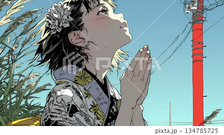 手を合わせてお祈りをしている和服姿の若い女性