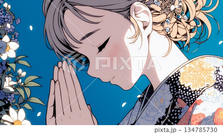 手を合わせてお祈りをしている和服姿の若い女性